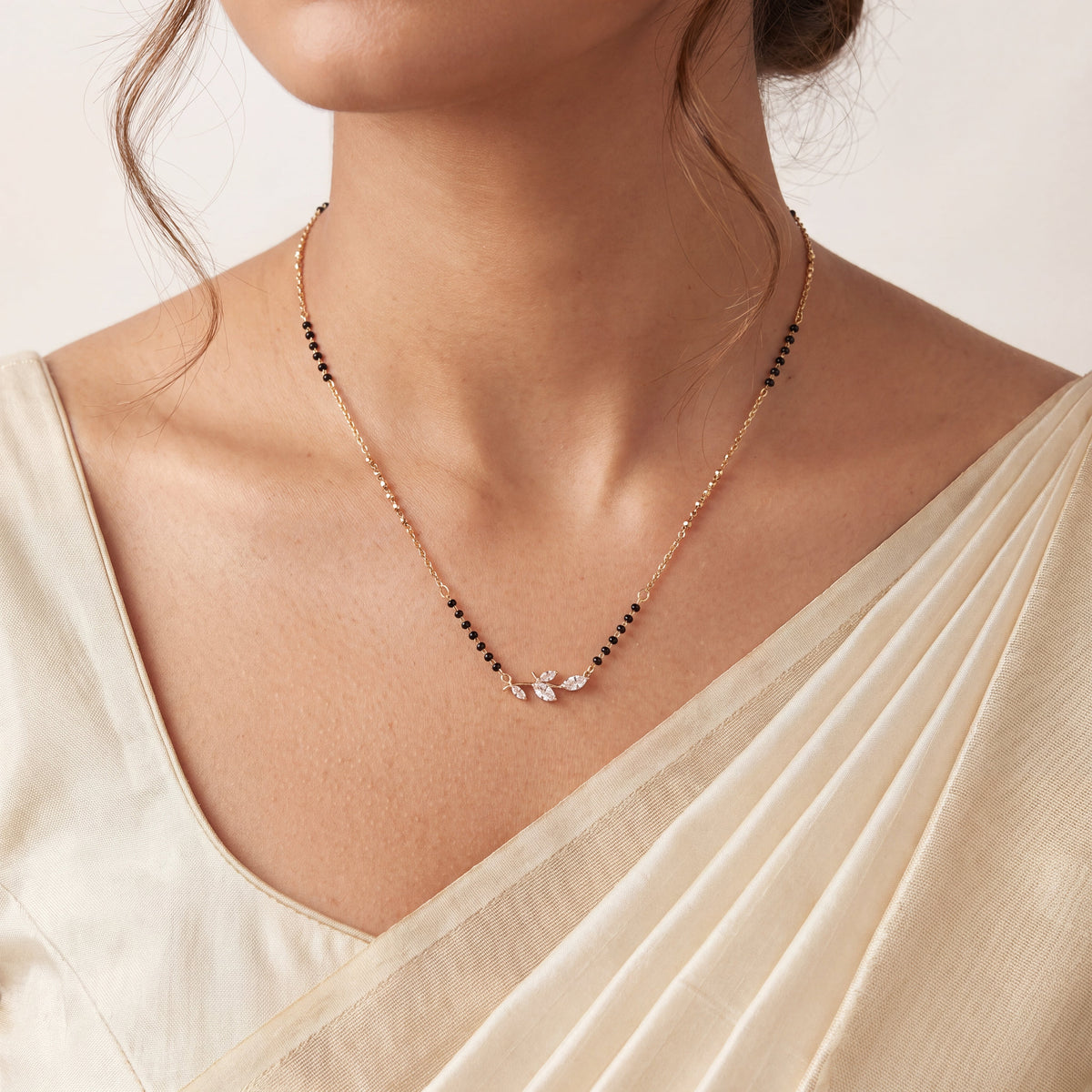 CZ Marquise Leaf Branch Mangalsutra - Gold tone worn on model with cream saree