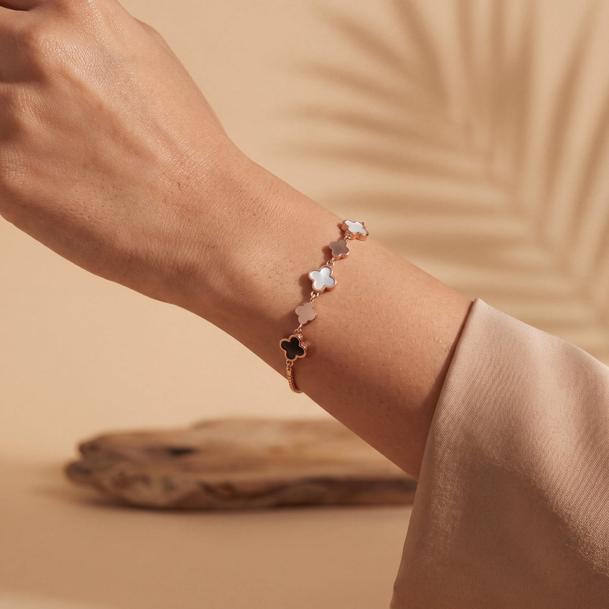 Mother of Pearl Onyx Clover Station Bracelet - Rose Gold tone AI lifestyle close up detail shot